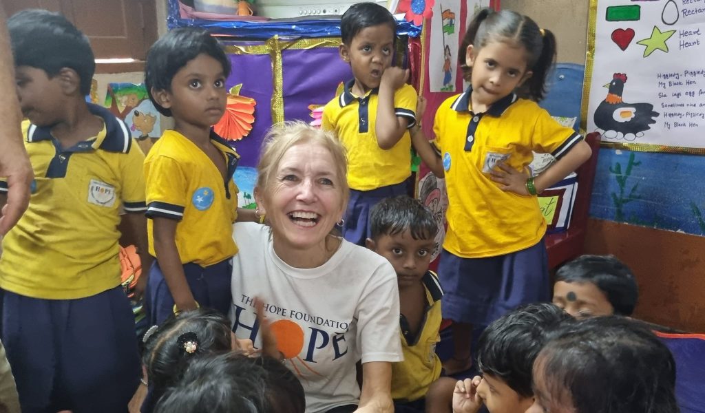 Maura with children from a HOPE creche