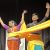 man and a woman in a traditional indian clothes, dancing on a stage